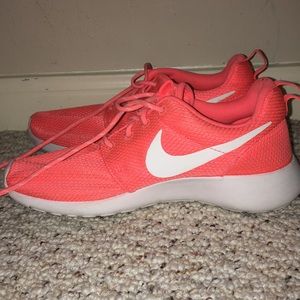 Neon coral/pink Nike roshes